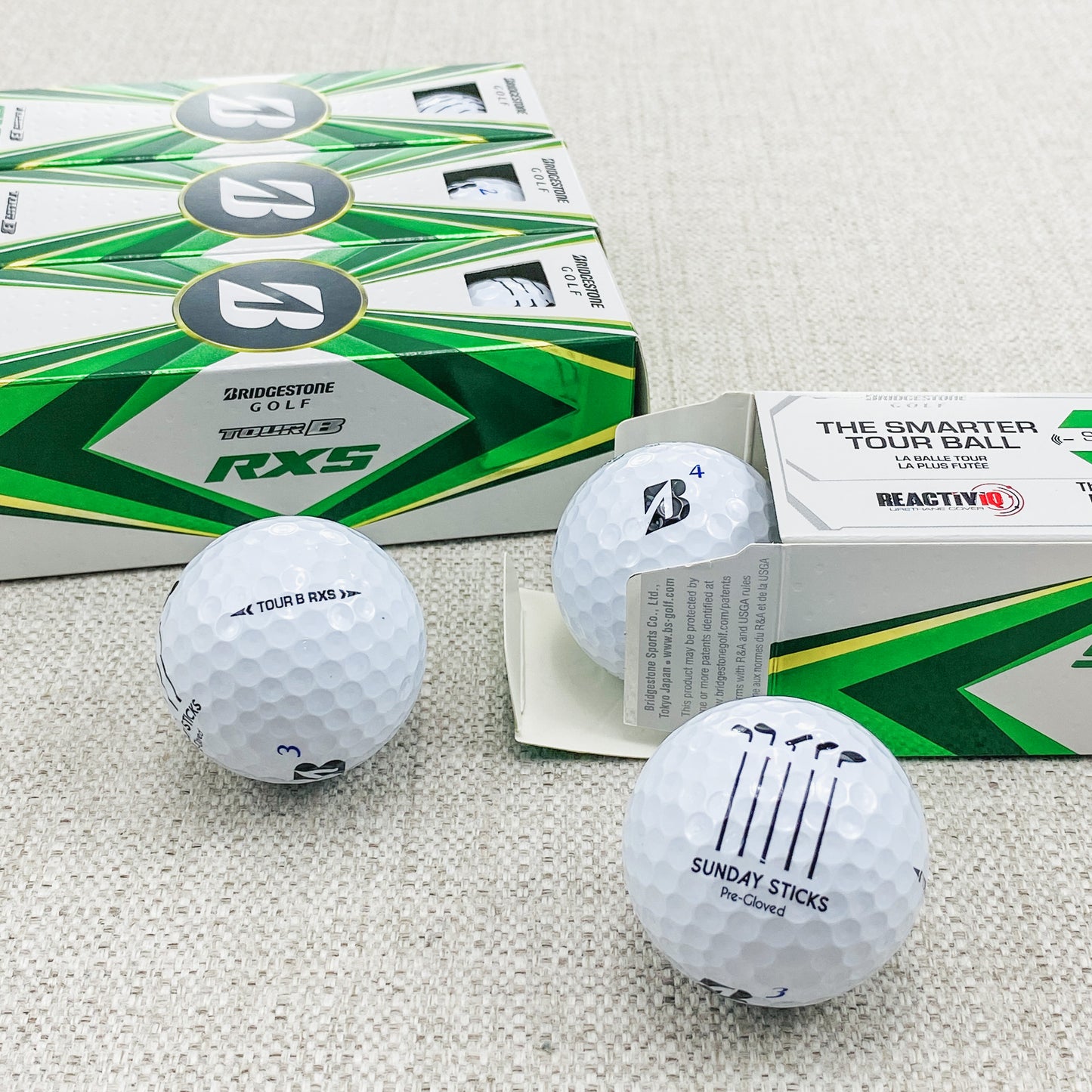 2022 Bridgestone Tour B-RXS (white) - 2 x dozen, brand new. Sunday Sticks logo.